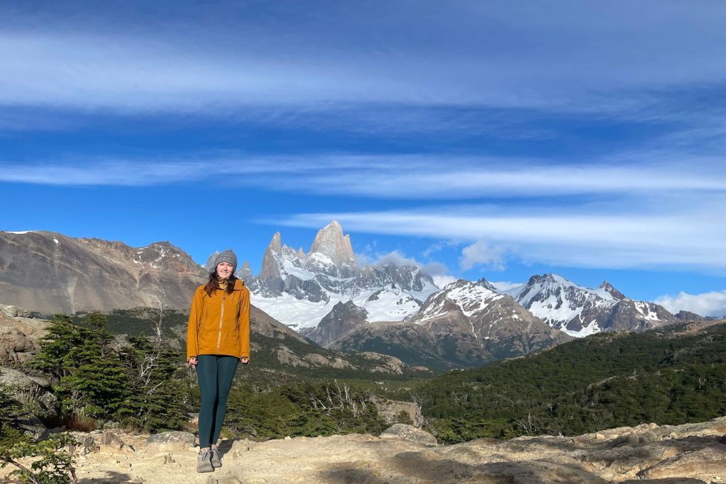 View of Laguna de los Tres from the Mirador viewpoint with woman in orange hiking coat